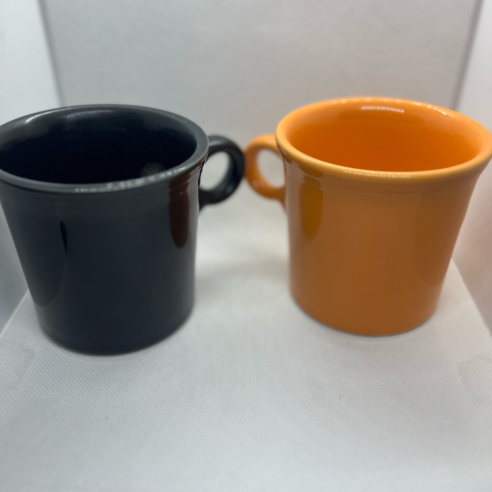 Set of two Fiestaware ring handled mugs retired colors Tangerine and Black